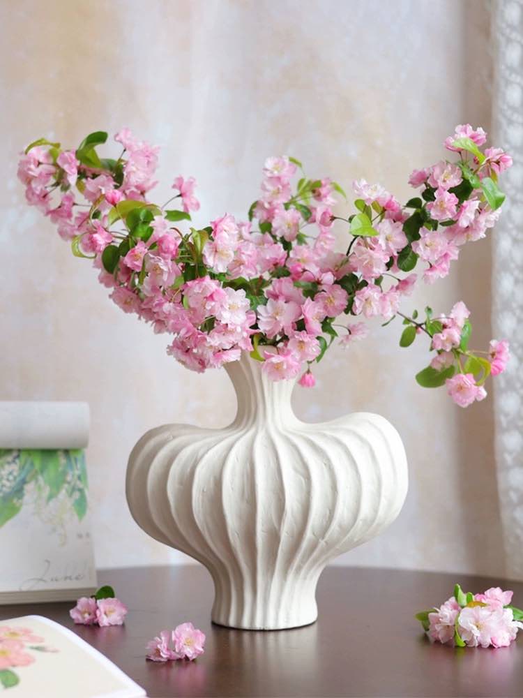 Handmade wabi sabi ceramic pottery vase in brick red with crude texture